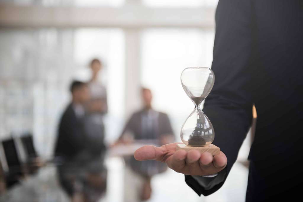 businessman-holding-hour-glass-signifies-importance-being-time